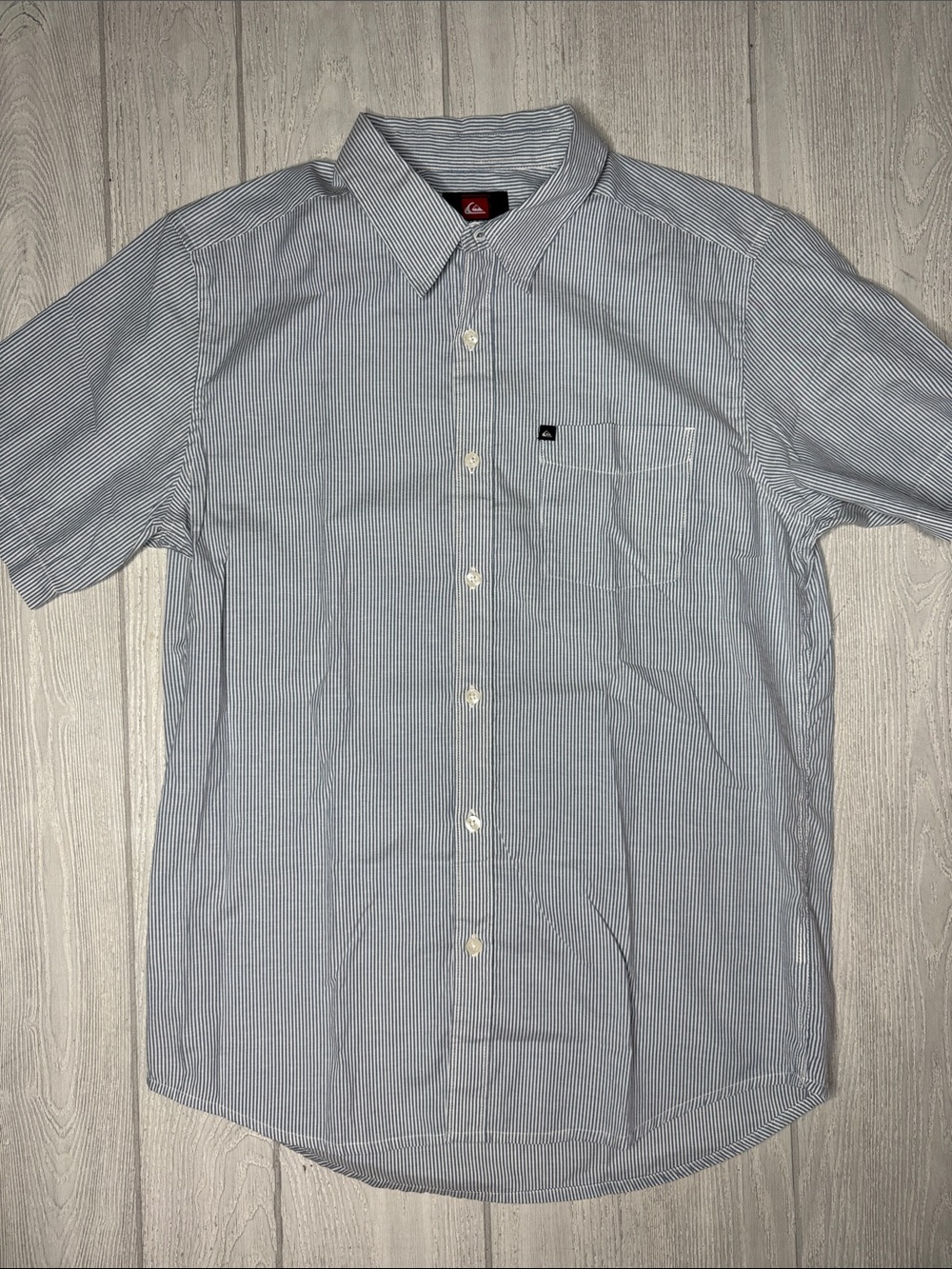 Quiksilver short sleeve button-up shirt, blue and white pinstripes. Small, Men